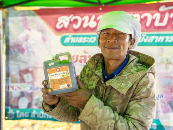 P'kek selling organic tamarind sauce in Ubon market