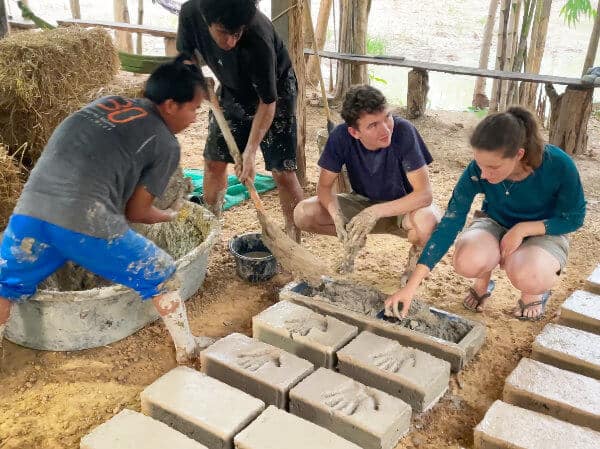 Using adobe brick mould for sustainable building course