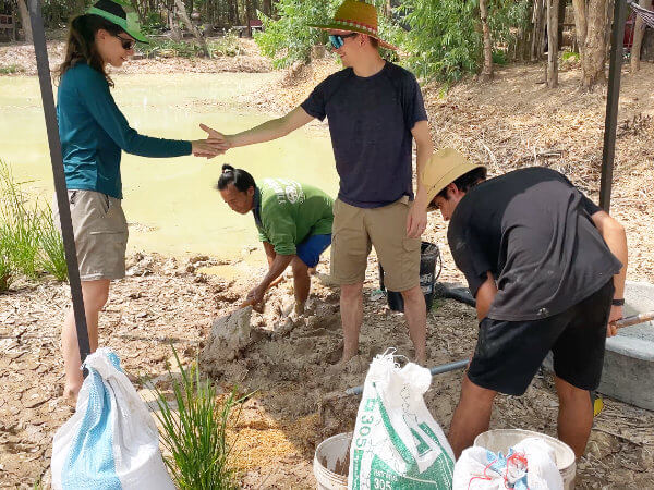 mixing clay and risk husks for sustainable adobe building