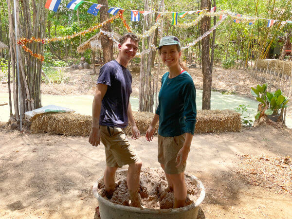 mixing clay with rice husks for natural adobe building